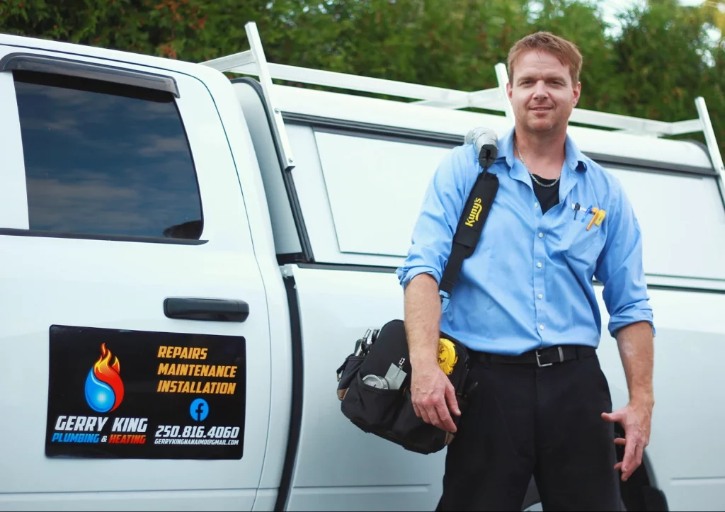 photo of Gerry King in front of work truck with plumbing and heating tools in a bag, nanaimo, bc